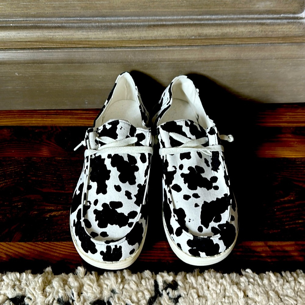 Cow print slide ons